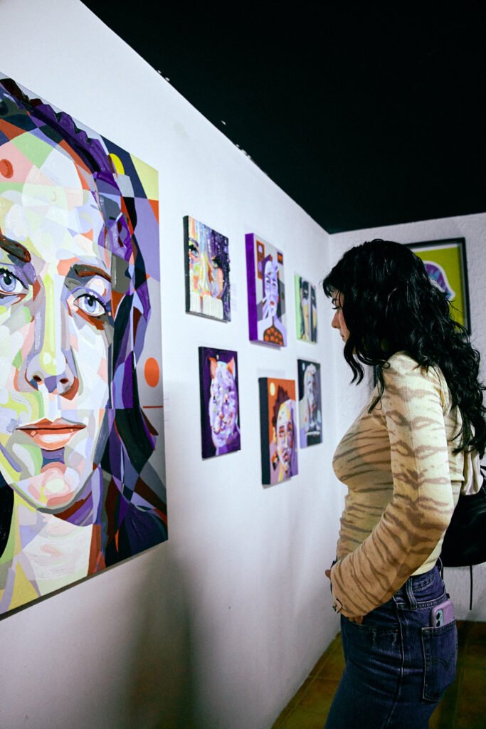 Mélange Expo viewing paintings at art event in Barcelona